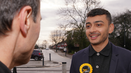 Young Councillor Anton talking to a voter